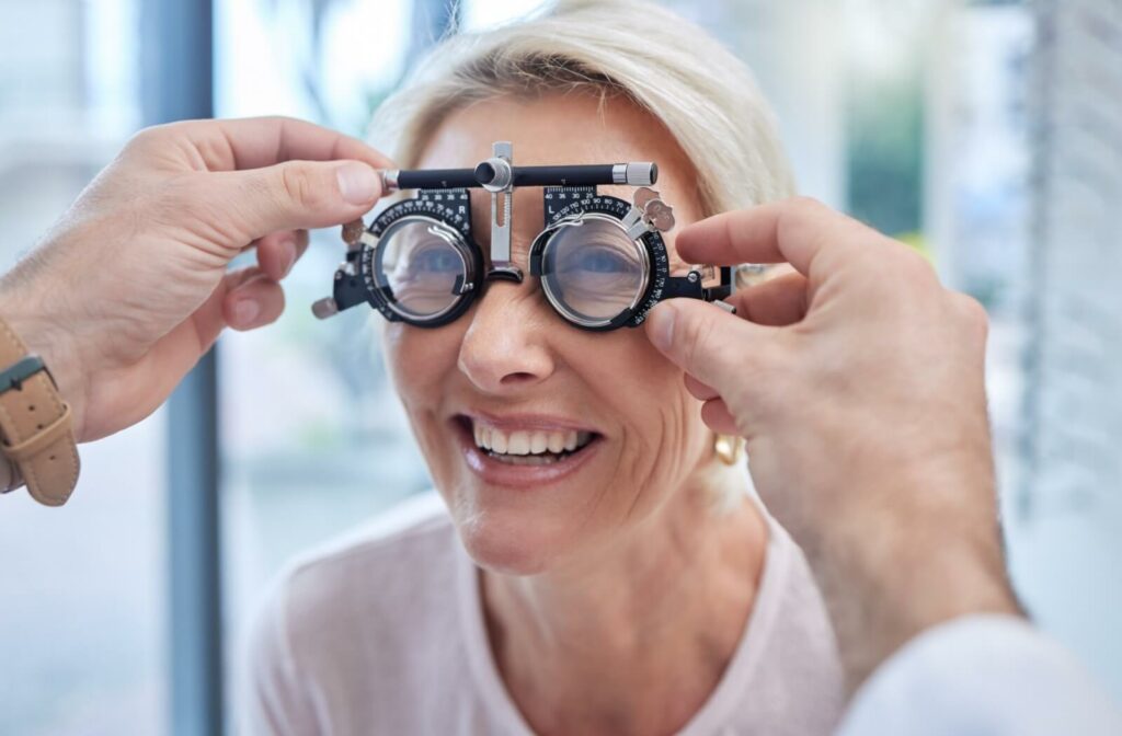 An optometrist fitting a patient with corrective lenses.